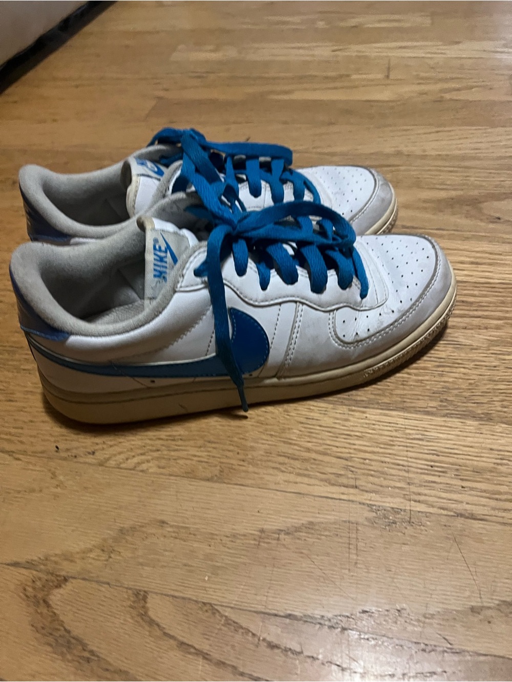 Nike White Sneakers with Blue Swoosh and Blue Laces